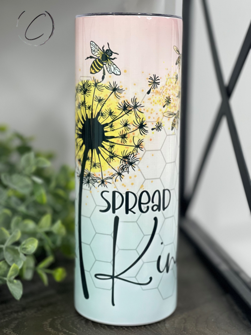 A stylish 20oz skinny tumbler with a vibrant 'Spread Kindness' design, featuring a reusable straw and a durable, high-quality finish.