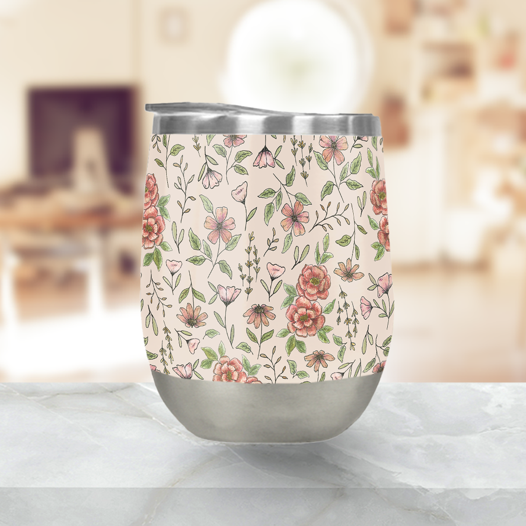 Spring Floral Stemless Wine Tumbler with vibrant floral design, showcasing its stainless steel construction and plastic lid.