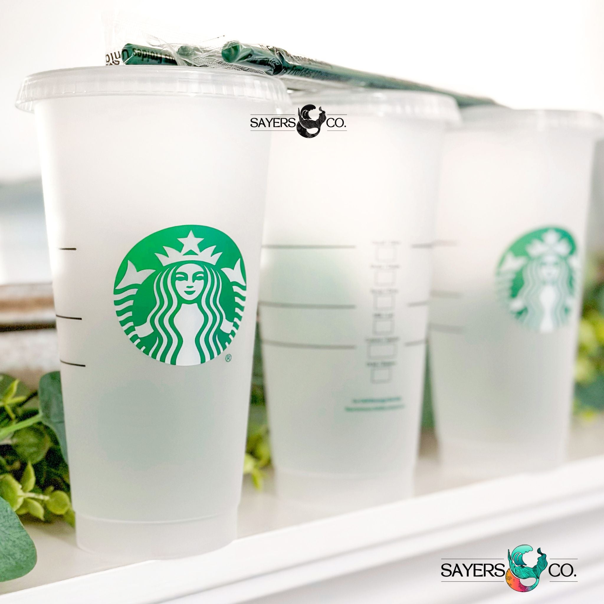A pack of 20 Starbucks Blank 24 oz Cold Cups with lids and straws, perfect for DIY projects and customization.