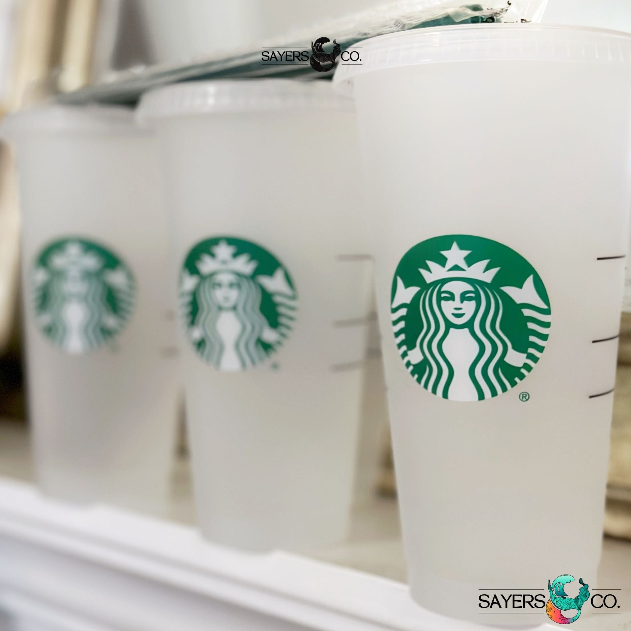 A pack of 20 Starbucks Blank 24 oz Cold Cups with lids and straws, perfect for DIY projects and customization.