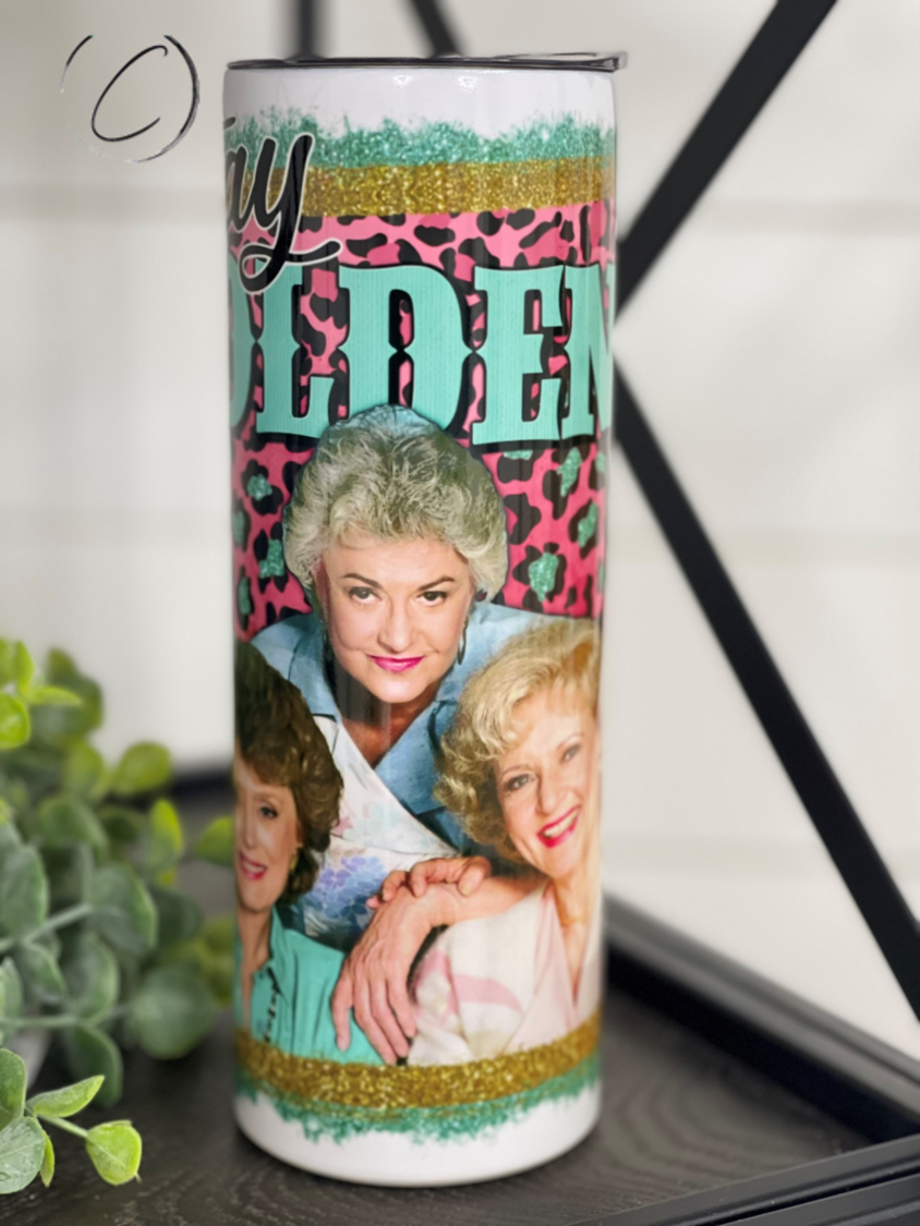 Stay Golden 20oz Skinny Tumbler with a stylish design, perfect for hot and cold drinks, featuring a reusable straw.