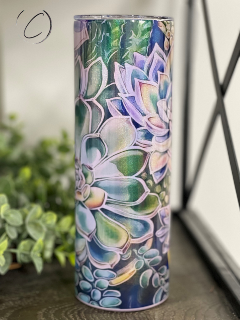 A 20oz Shimmer Skinny Tumbler featuring a vibrant succulent design with a rainbow shimmer effect, perfect for stylish hydration.