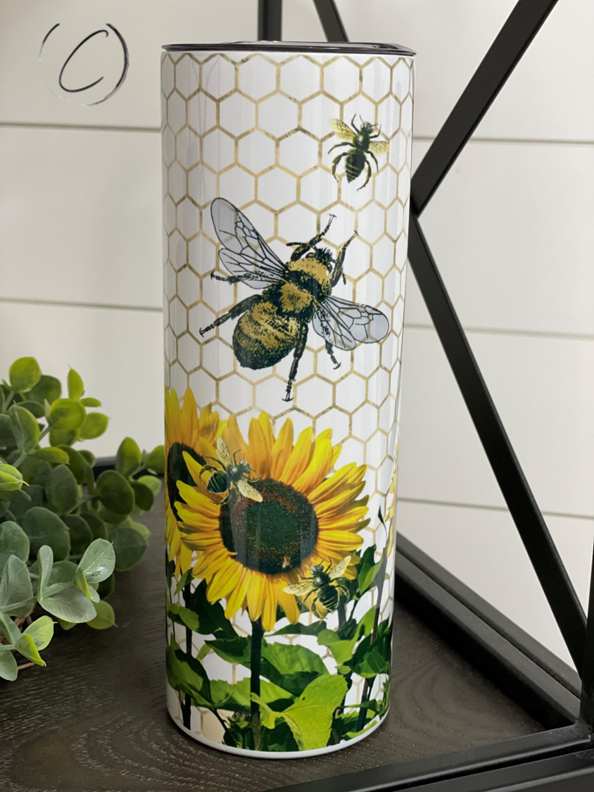 Sunny With A Little Honey 20oz Skinny Tumbler featuring a vibrant design, reusable straw, and durable construction.