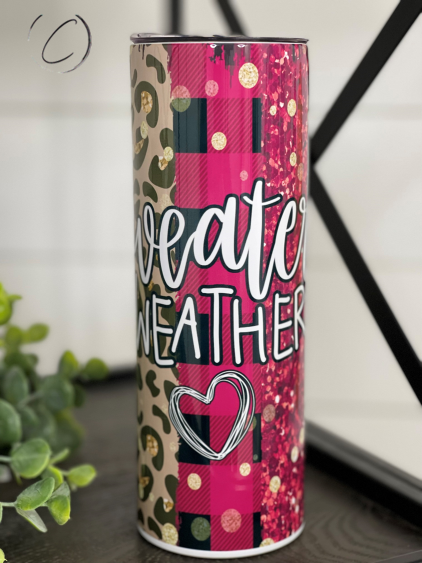 A stylish 20oz skinny tumbler featuring a cozy sweater weather design, perfect for hot and cold beverages.