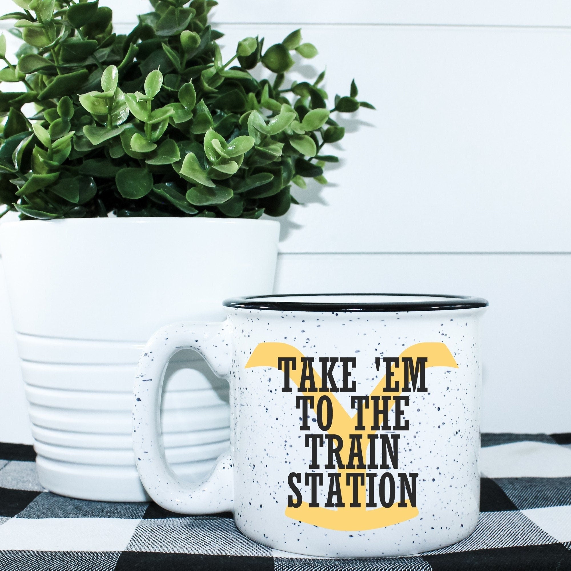 Take 'Em To The Train Station Campfire Mug with a unique design, perfect for cozy beverages.