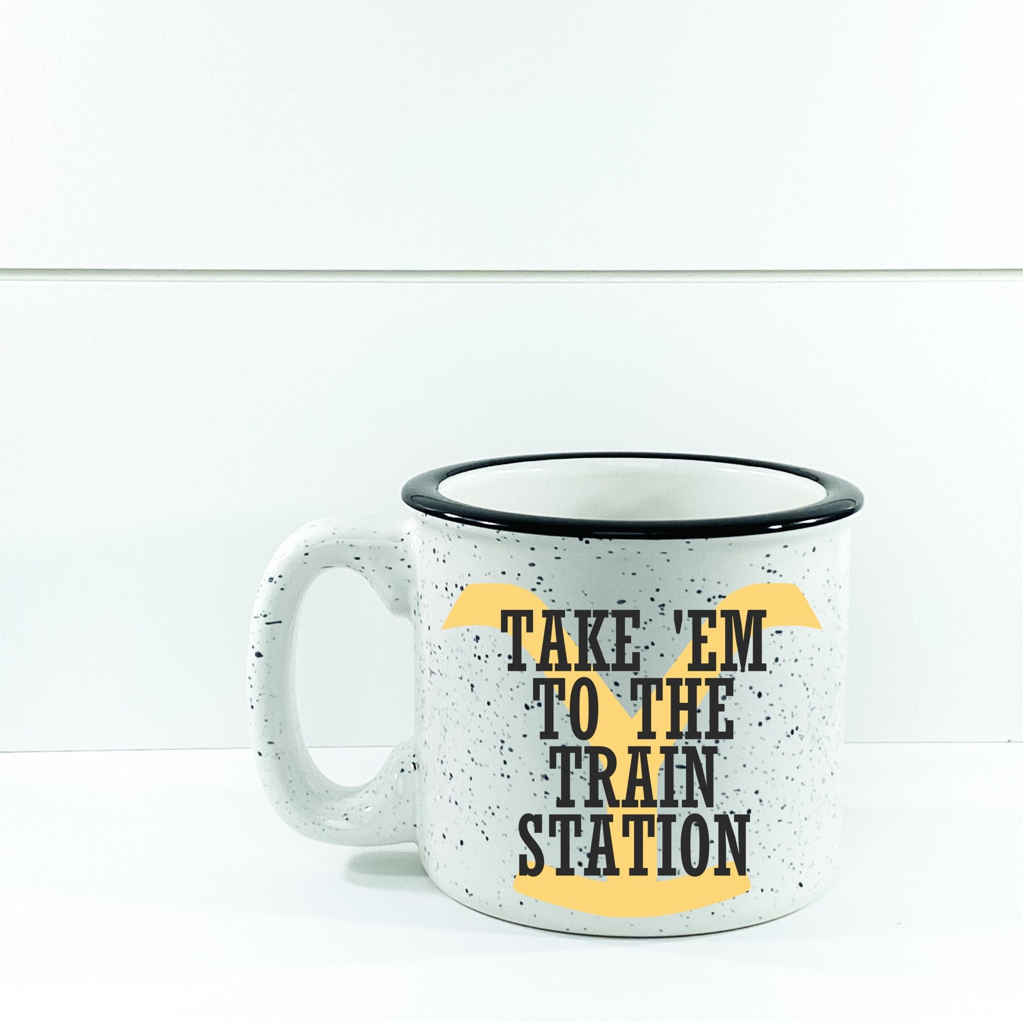 Take 'Em To The Train Station Campfire Mug with a unique design, perfect for cozy beverages.