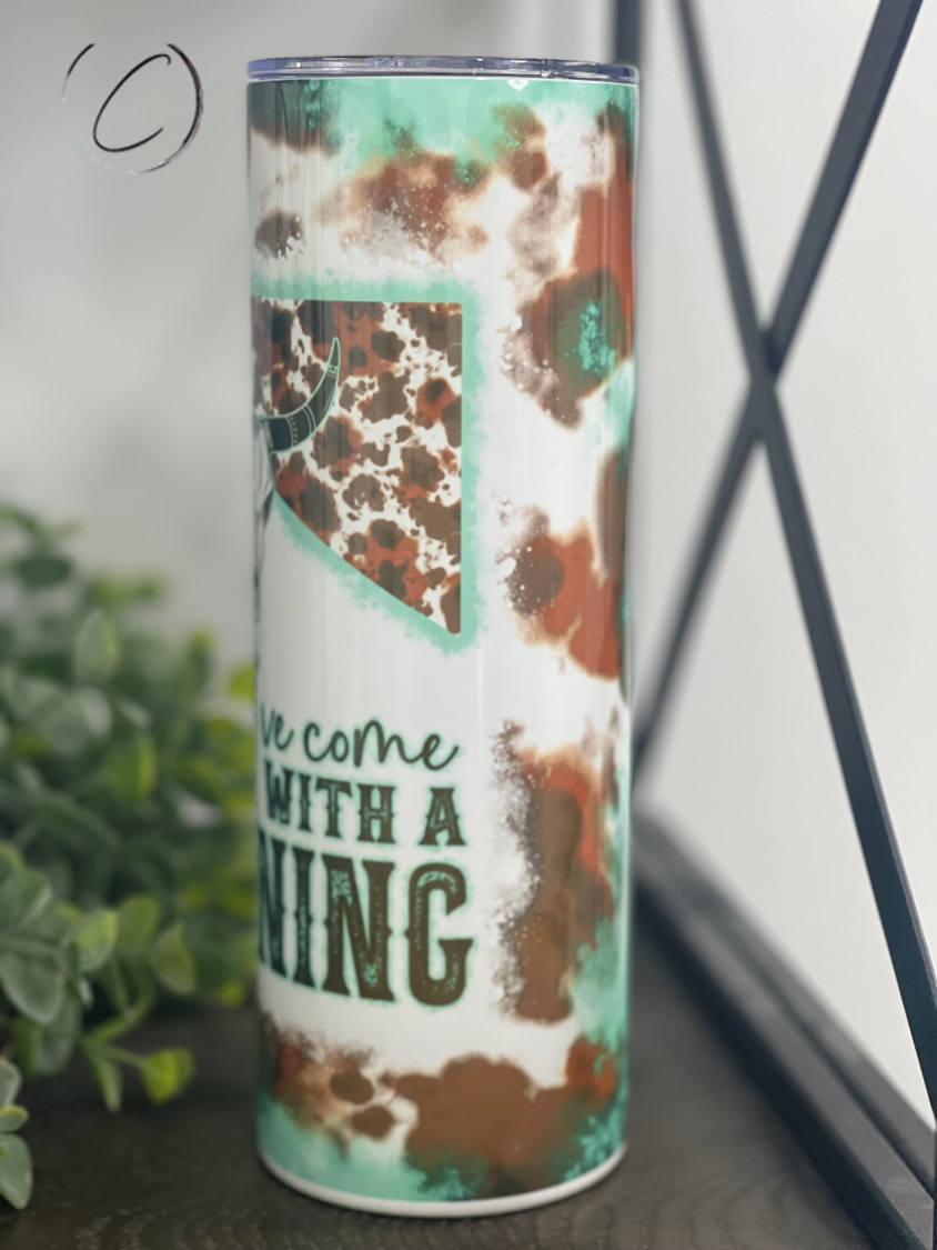 Teal 20oz skinny tumbler with a unique design, featuring a reusable straw and a durable construction for hot and cold beverages.