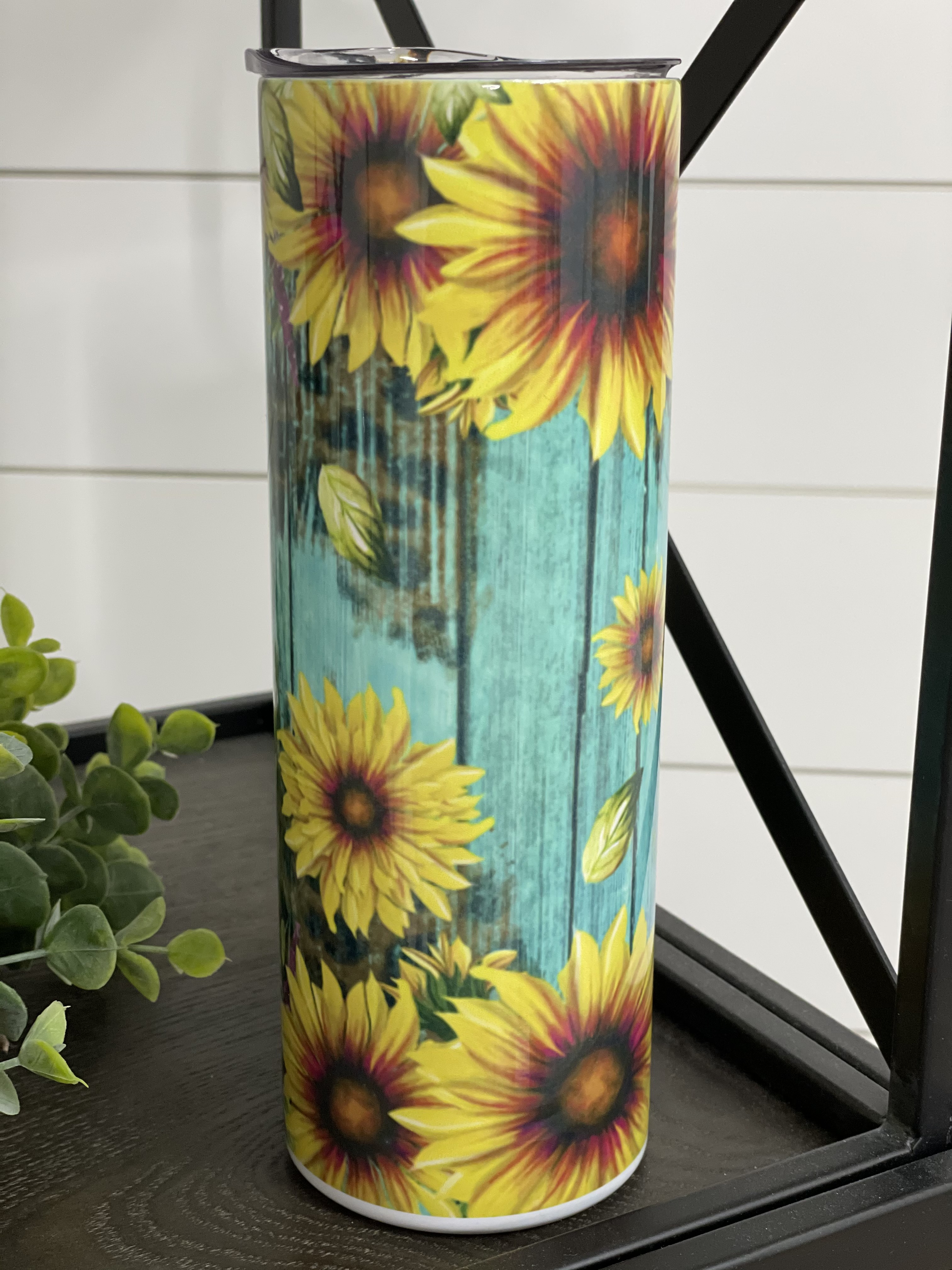 Teal Sunflower Leopard 20oz Skinny Tumbler with a vibrant design featuring sunflowers and leopard print.