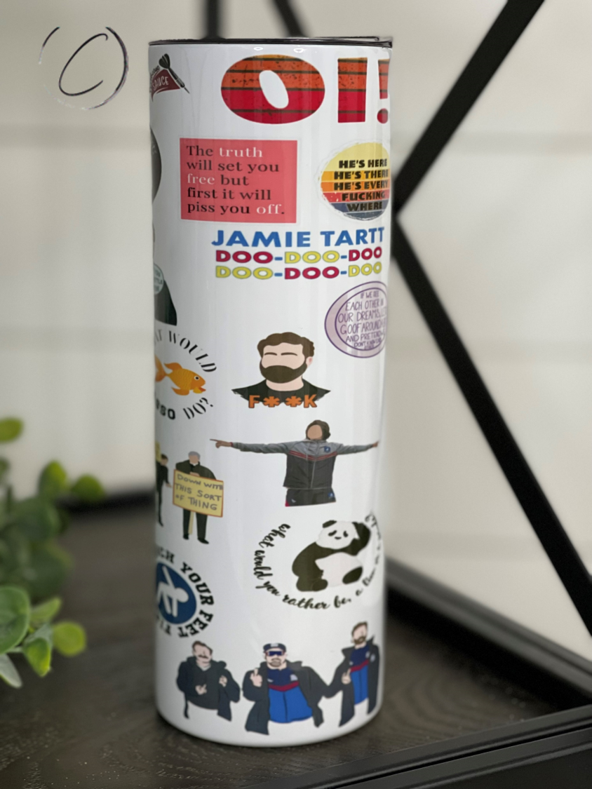 Ted Lasso 20oz Skinny Tumbler featuring a vibrant design, reusable straw, and insulated body for hot and cold beverages.