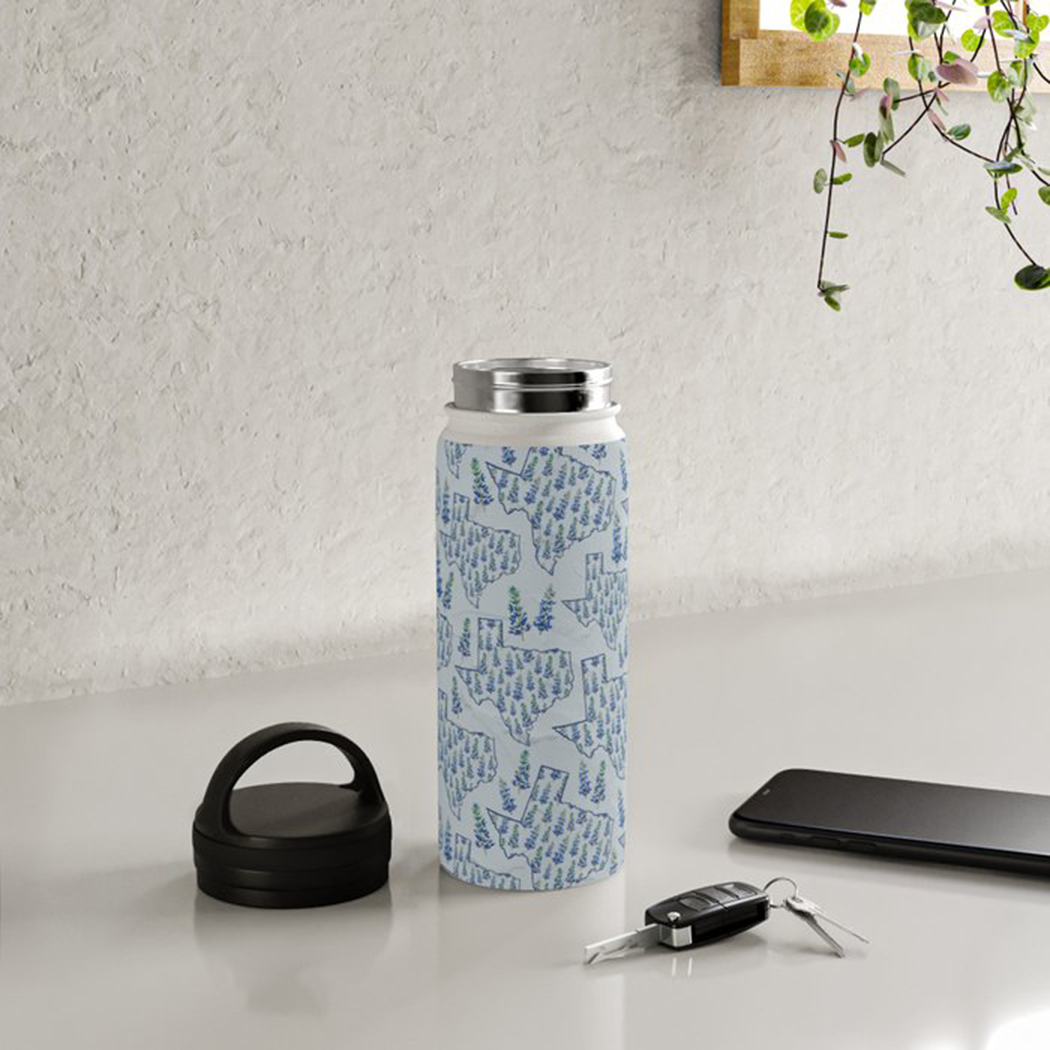 Texas Blue Bonnet Handle Lid Water Bottle in matte stainless steel with floral design, showcasing its durable and stylish features.