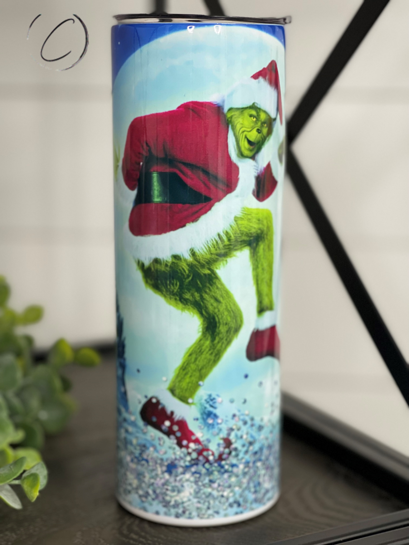 The Grinch Throat Punch 20oz Skinny Tumbler featuring a vibrant Grinch design, perfect for festive drinks.