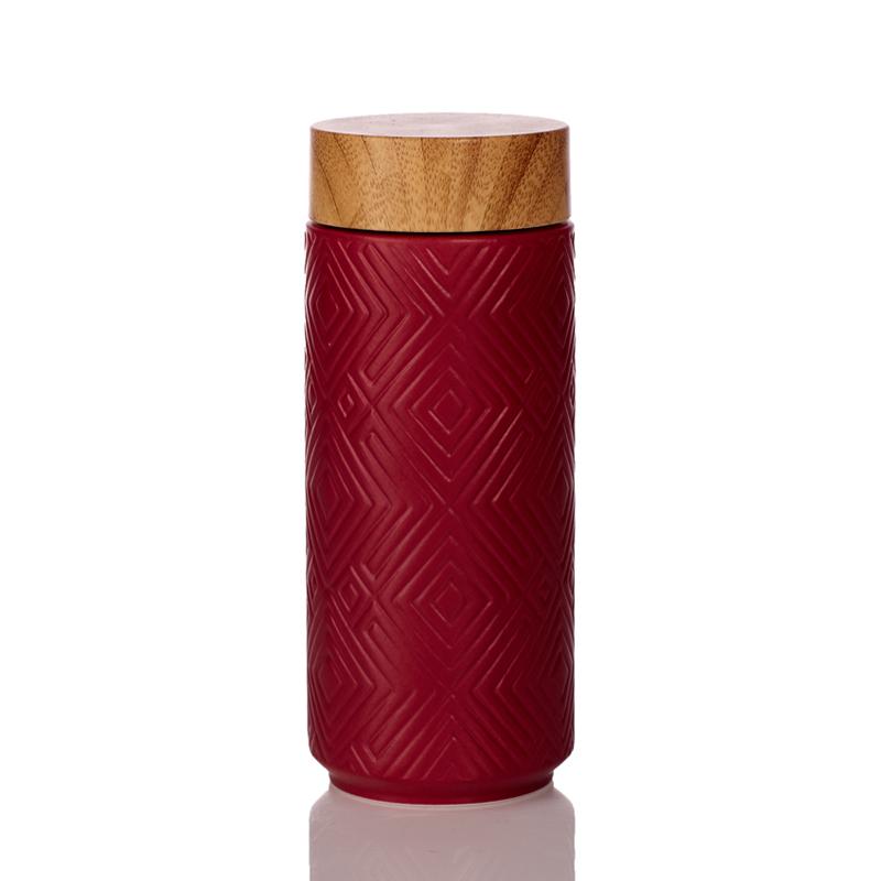 The Miracle Ceramic Tumbler showcasing its elegant design with a bamboo effect lid, featuring a tourmaline lining for enhanced beverage purity.