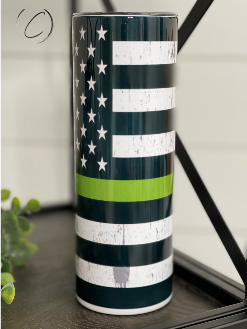 Thin Green Line 20oz Skinny Tumbler with a full wrap design, featuring a durable construction and a reusable straw.
