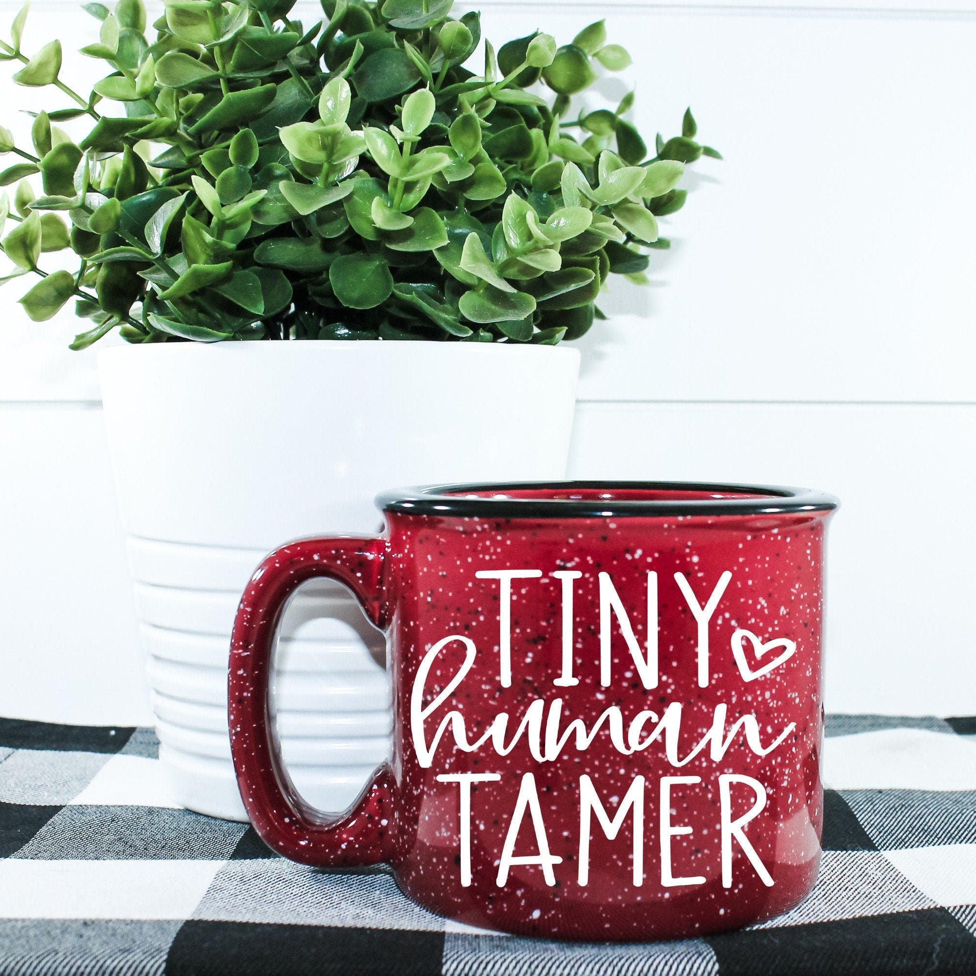 Tiny Human Tamer Campfire Mug in ceramic with a unique design, perfect for coffee or tea.
