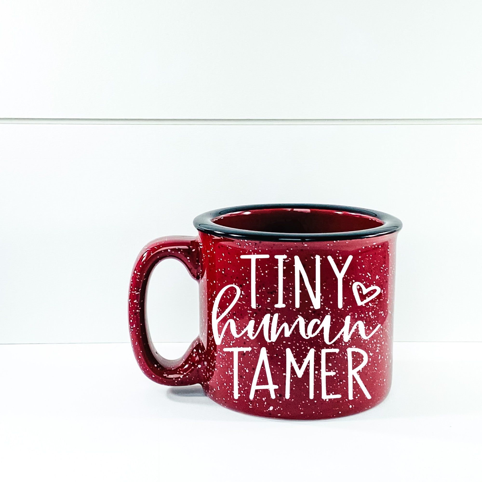 Tiny Human Tamer Campfire Mug in ceramic with a unique design, perfect for coffee or tea.