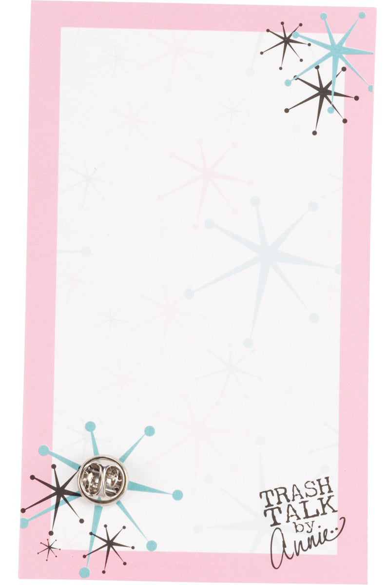 A circular Tired AF enamel pin featuring a moon design with spiked trim, displayed on a vintage photograph gift card.