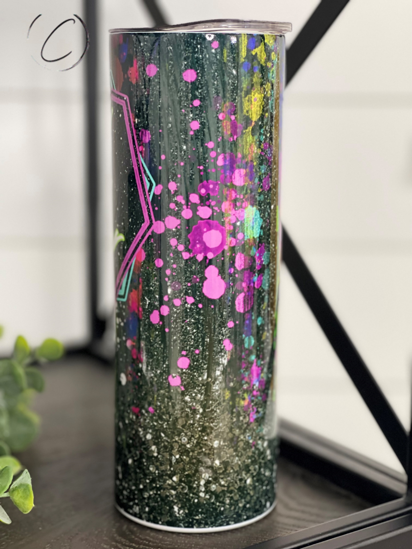 Tired As A Mother Splatter 20oz Skinny Tumbler with vibrant splatter design and reusable straw.