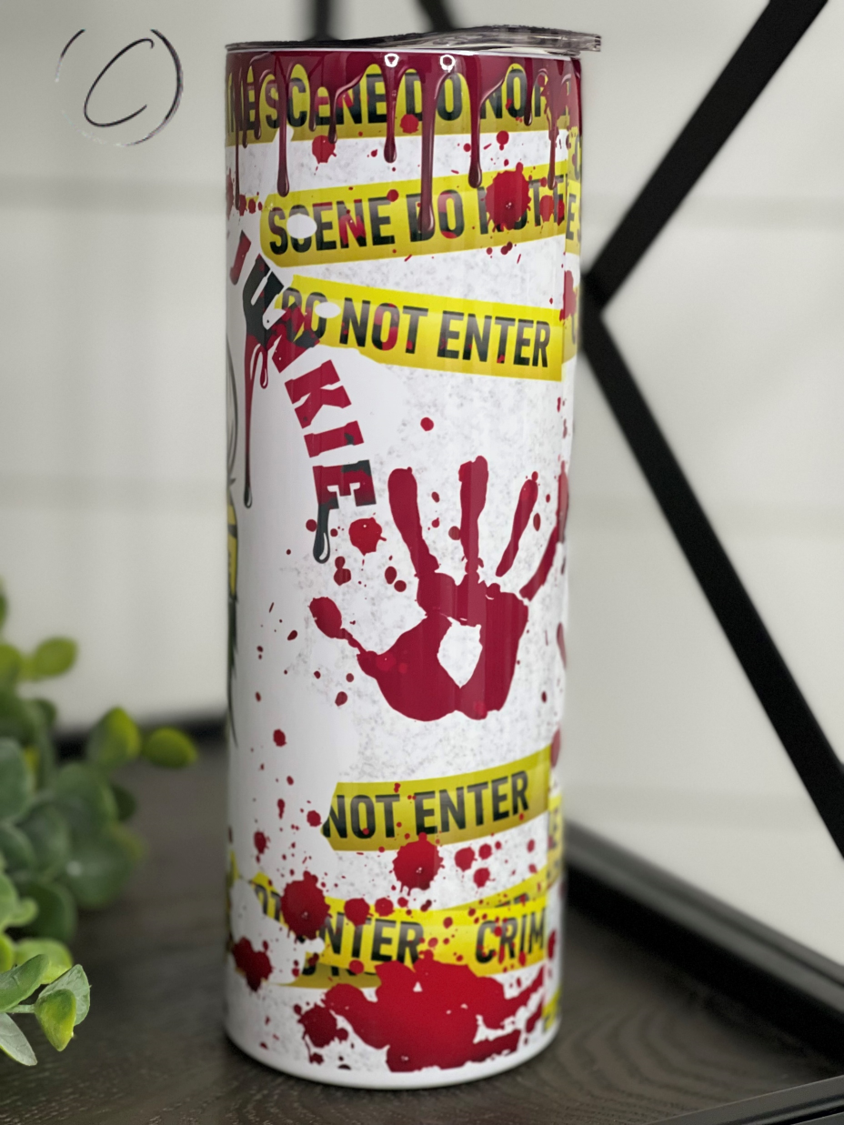 True Crime Junkie Messy Bun 20oz Skinny Tumbler featuring a stylish design perfect for true crime enthusiasts.