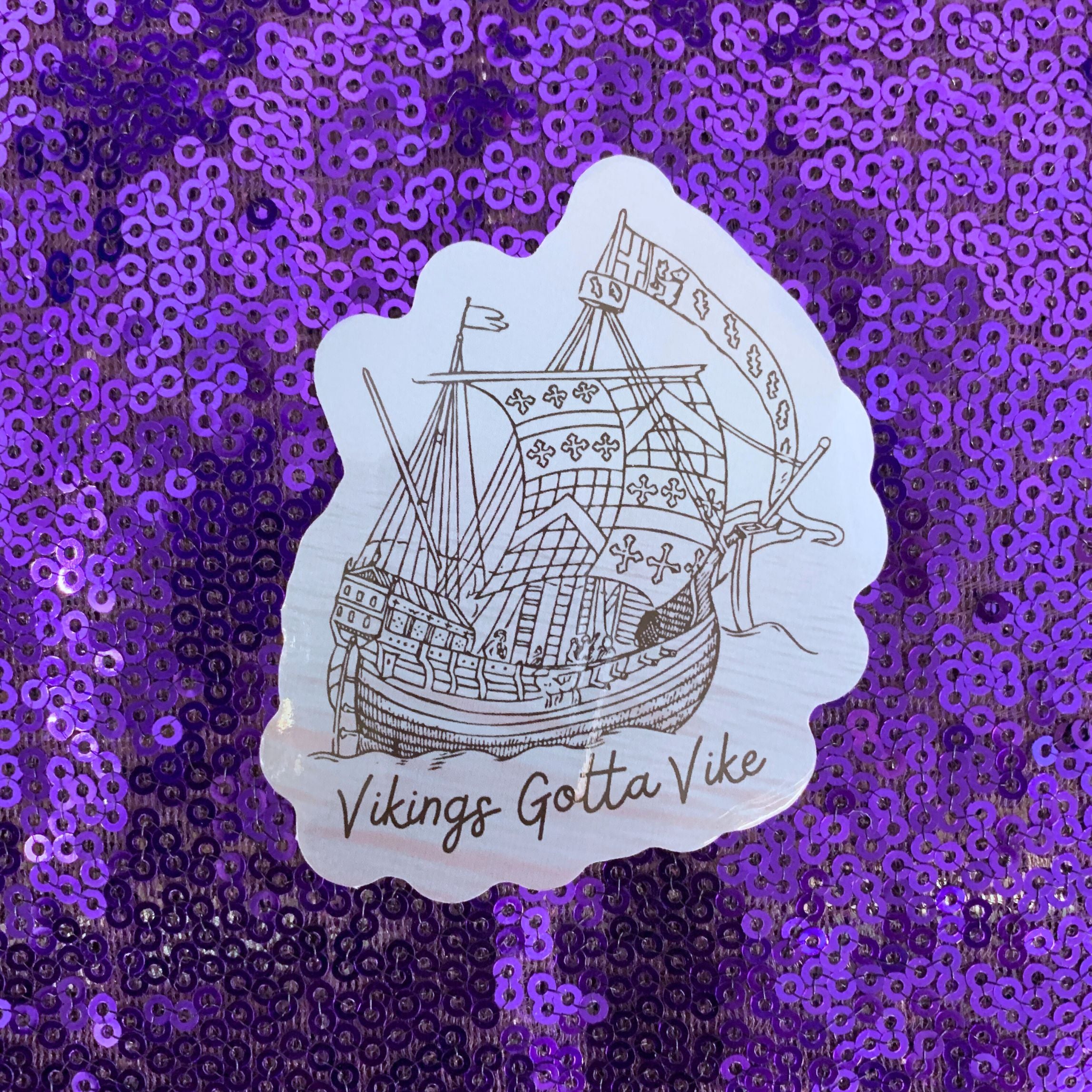Vikings Gotta Vike Sticker featuring bold text and a glossy finish, perfect for showcasing Nordic pride.