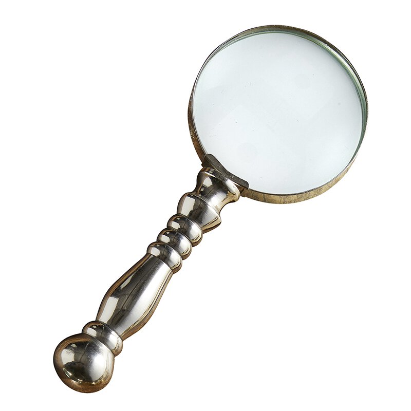 Vintage style magnifying glass with a silver handle, showcasing its elegant design and clear glass lens.