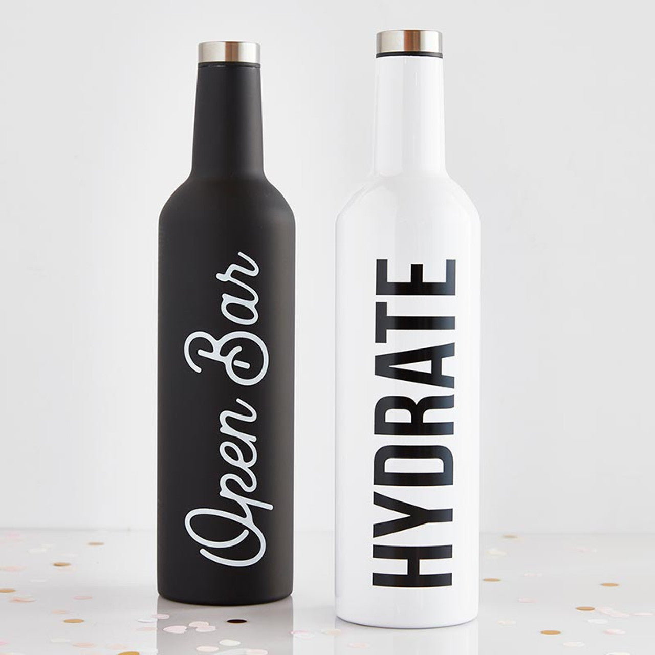 Two stainless steel bottles from the Water Into Wine 2 Bottle Set, each holding a full bottle of wine, stylishly designed with a black 'Hydrate' print.