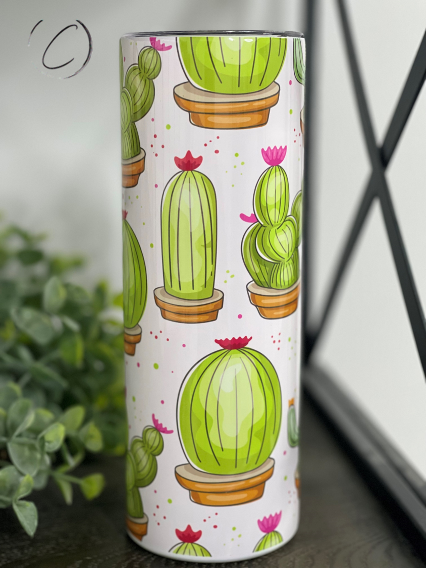A 20oz skinny tumbler featuring a vibrant watercolor cacti design, perfect for drinks on the go.