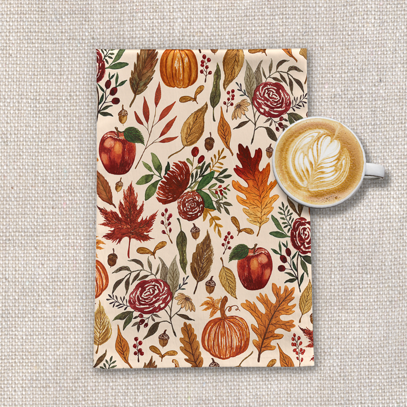A beautifully designed tea towel featuring watercolor pumpkins, leaves, and berries, made from durable cotton twill.