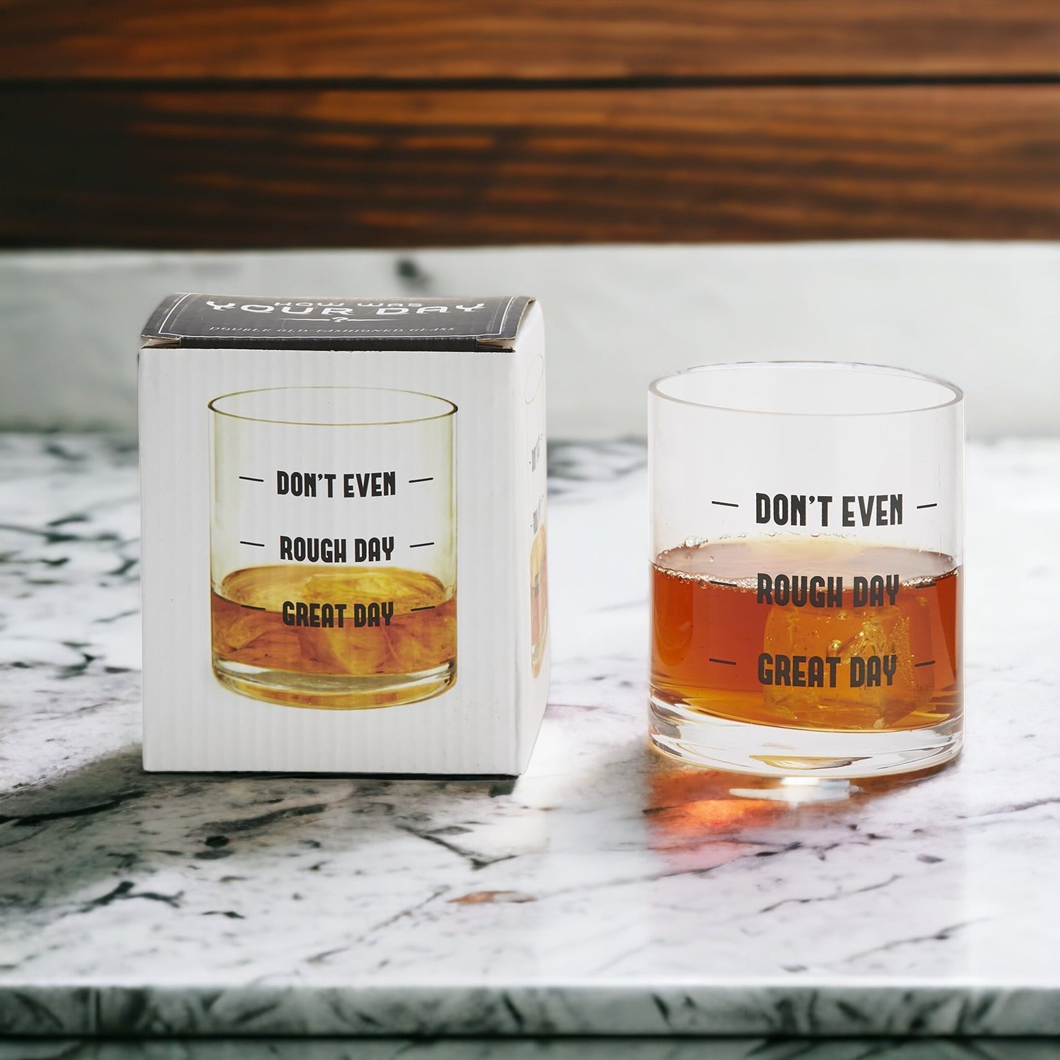 A set of elegant stemless wine and whiskey glasses with witty quotes, beautifully packaged in a decorative gift box.