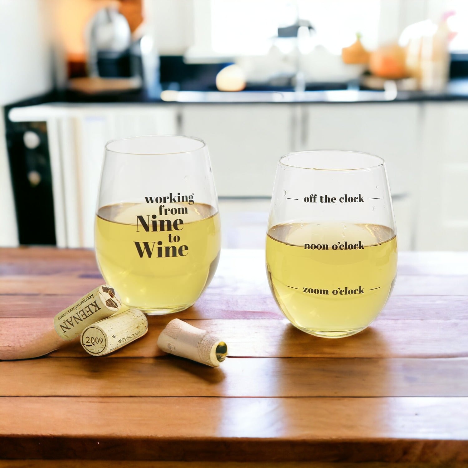 A set of elegant stemless wine and whiskey glasses with witty quotes, beautifully packaged in a decorative gift box.
