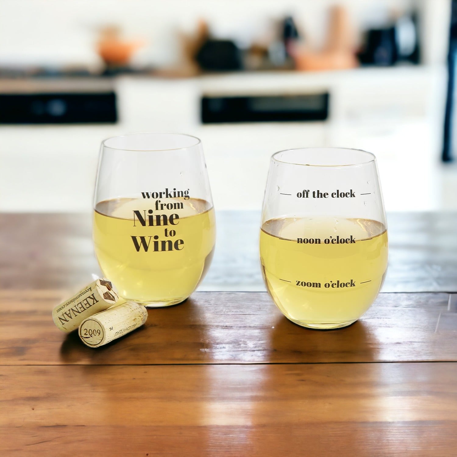 A set of elegant stemless wine and whiskey glasses with witty quotes, beautifully packaged in a decorative gift box.
