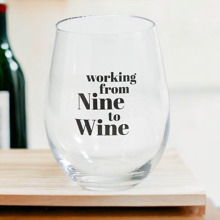 A set of elegant stemless wine and whiskey glasses with witty quotes, beautifully packaged in a decorative gift box.