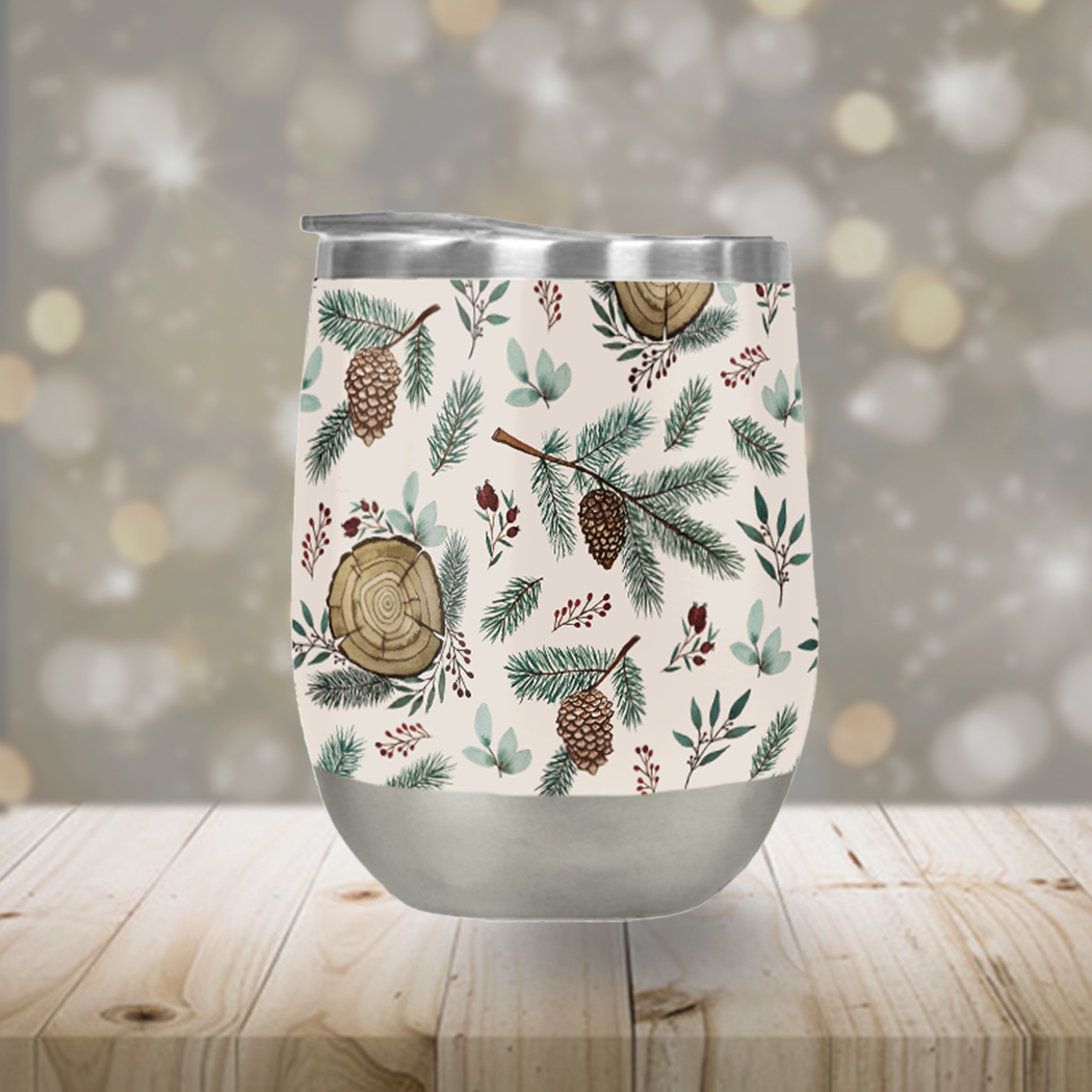 A stylish stemless wine tumbler featuring winter branches, berries, and pine cones design, made of stainless steel with a plastic lid.