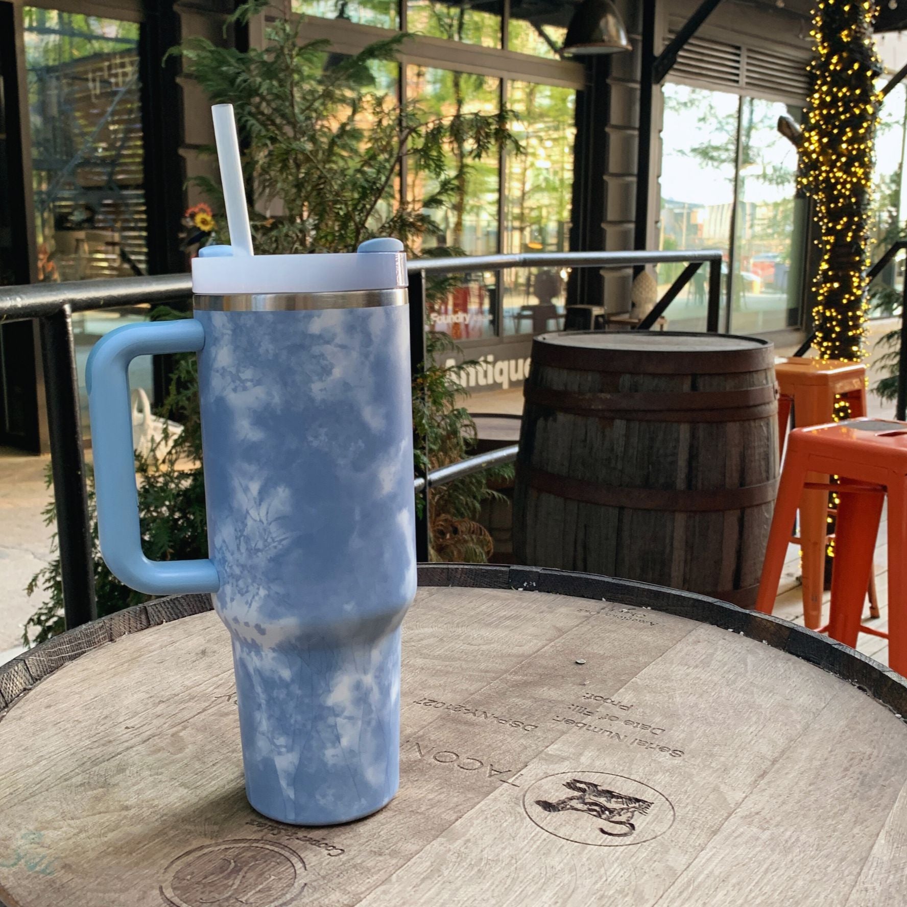 GetBullish Sticker Tumbler 40 oz in stainless steel with a whimsical design, perfect for hot and cold drinks.