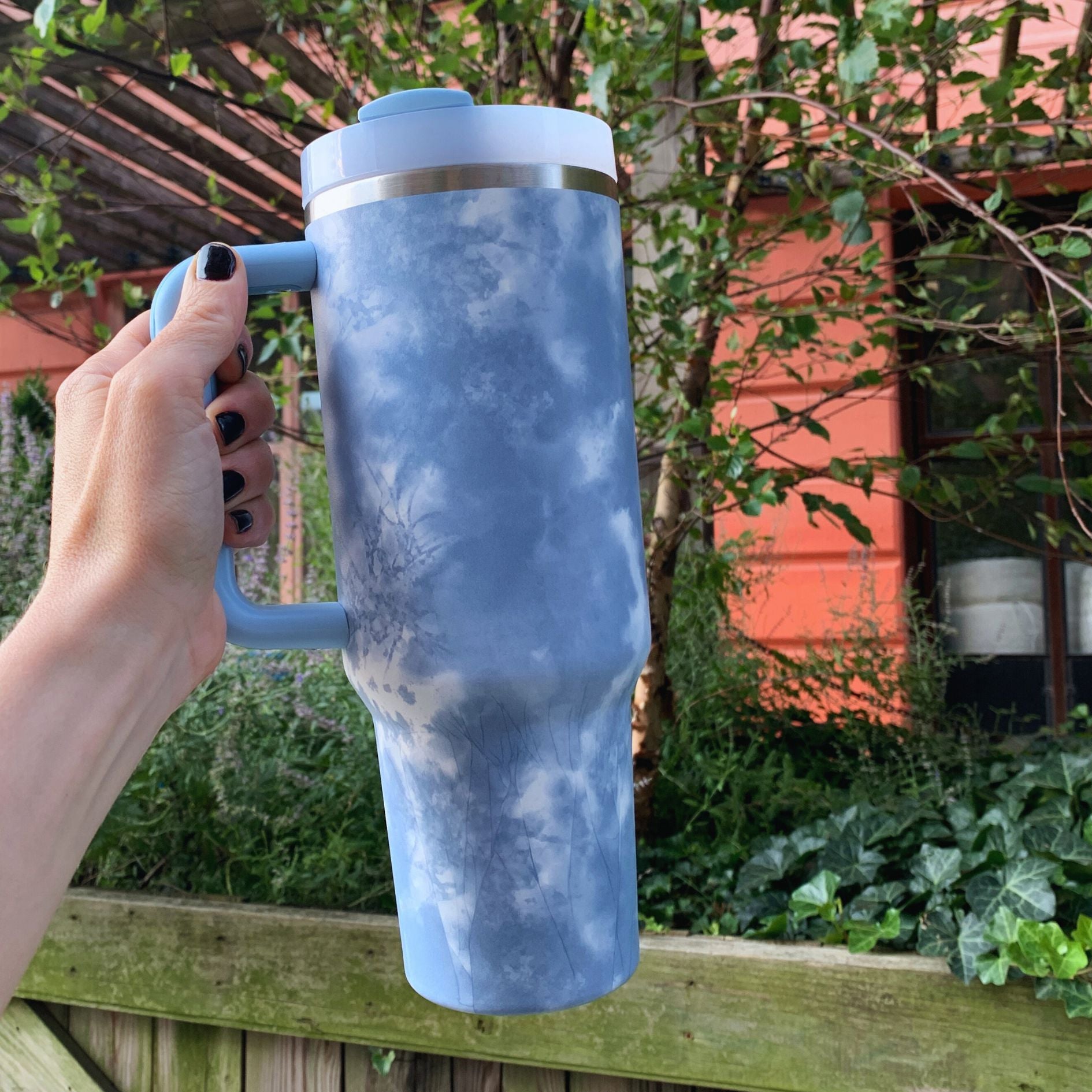 GetBullish Sticker Tumbler 40 oz in stainless steel with a whimsical design, perfect for hot and cold drinks.