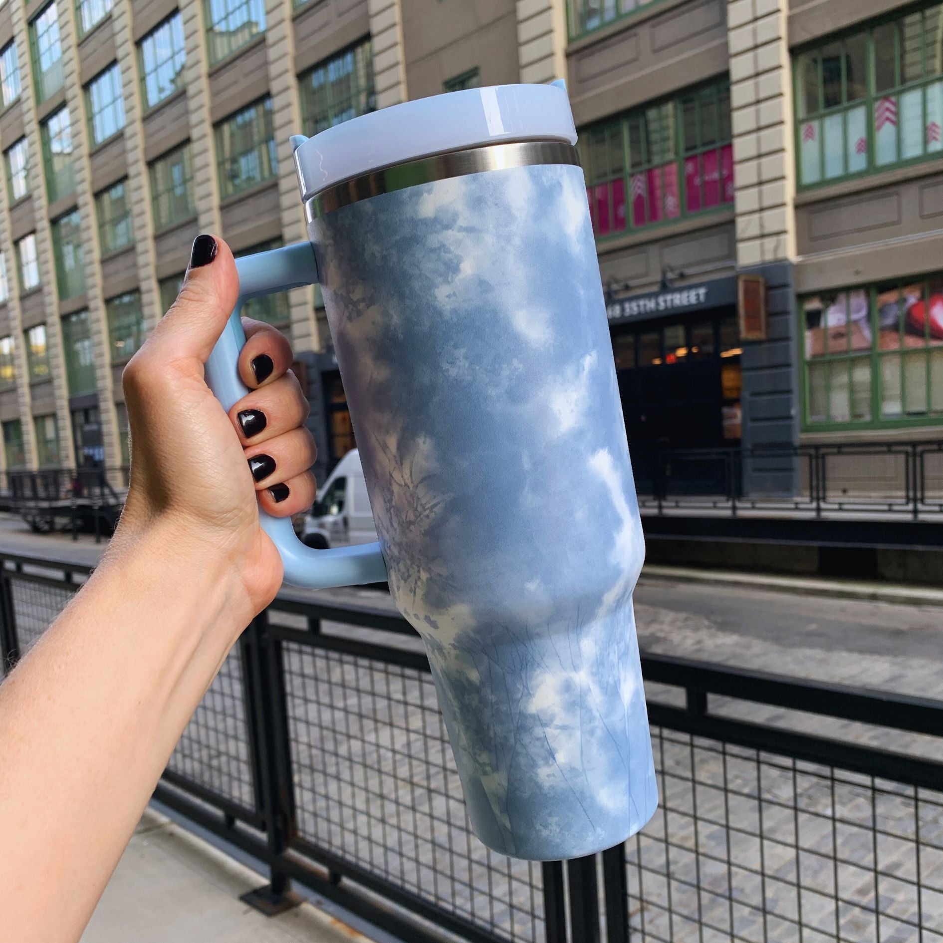 GetBullish Sticker Tumbler 40 oz in stainless steel with a whimsical design, perfect for hot and cold drinks.