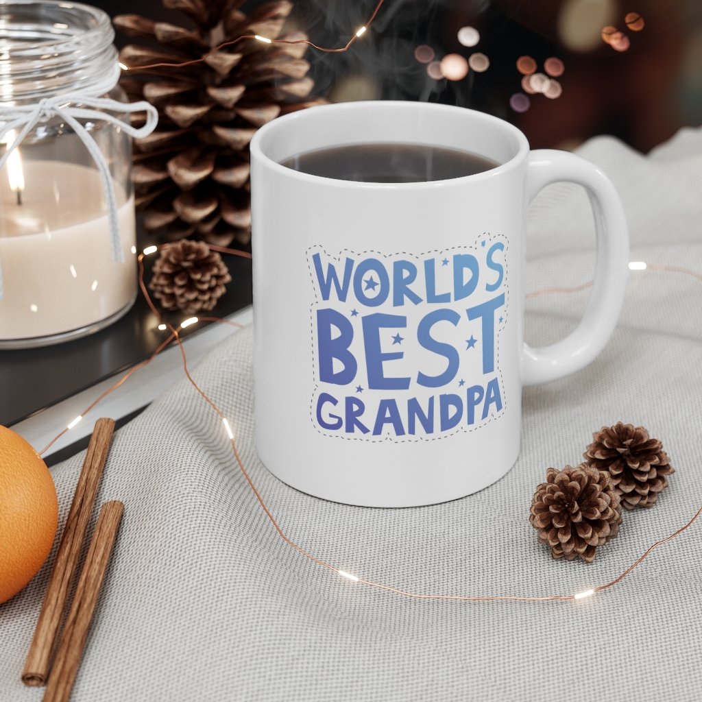 A white ceramic mug with the text 'World's Best Grandpa' printed on it, featuring a classic shape and C-handle.