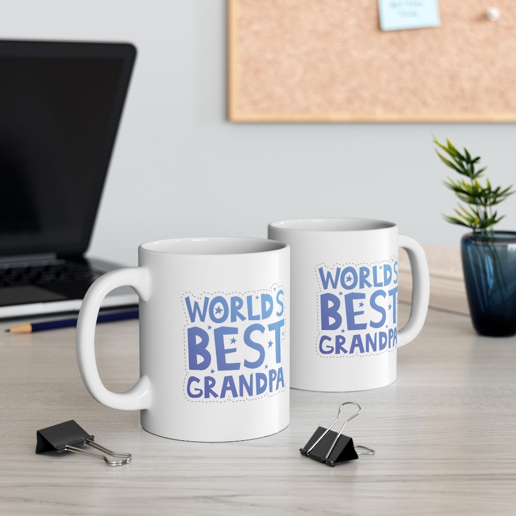 A white ceramic mug with the text 'World's Best Grandpa' printed on it, featuring a classic shape and C-handle.