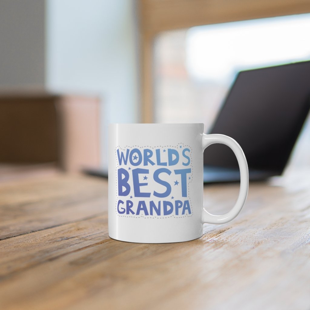 A white ceramic mug with the text 'World's Best Grandpa' printed on it, featuring a classic shape and C-handle.