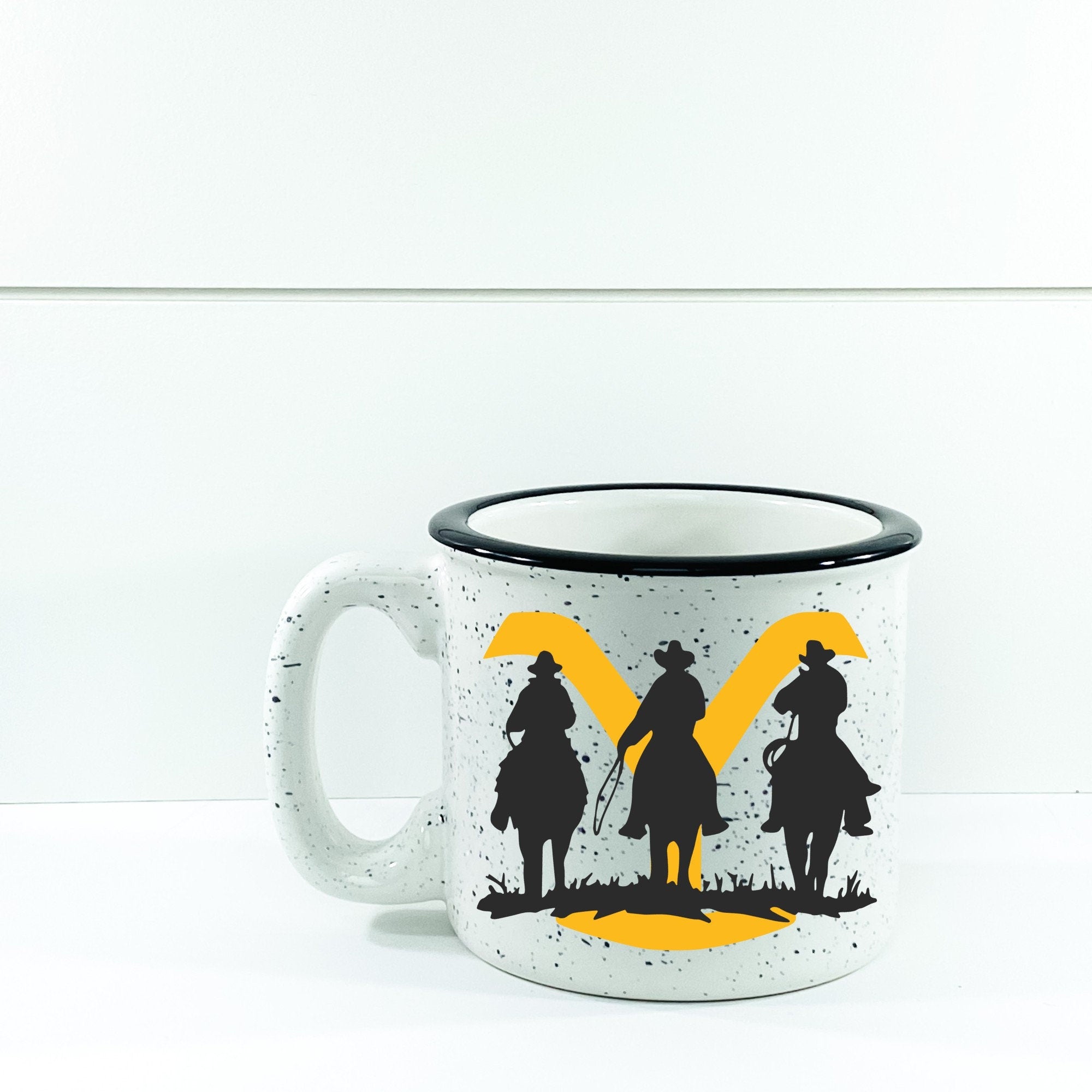 Yellowstone Ranch Cowboy Campfire Mug with cowboy design, ceramic material, and 15 oz capacity, perfect for outdoor use.