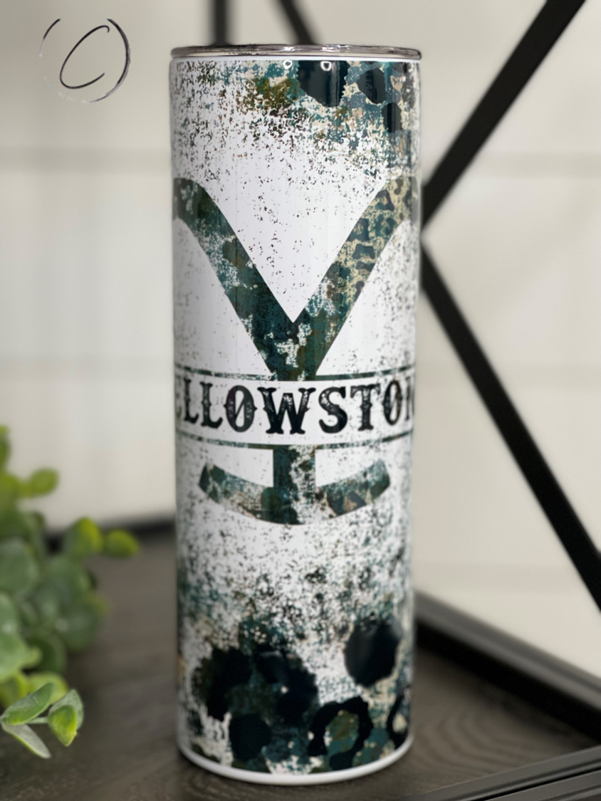 Yellowstone Rustic Leopard 20oz Skinny Tumbler with a unique leopard print design, featuring a reusable straw.