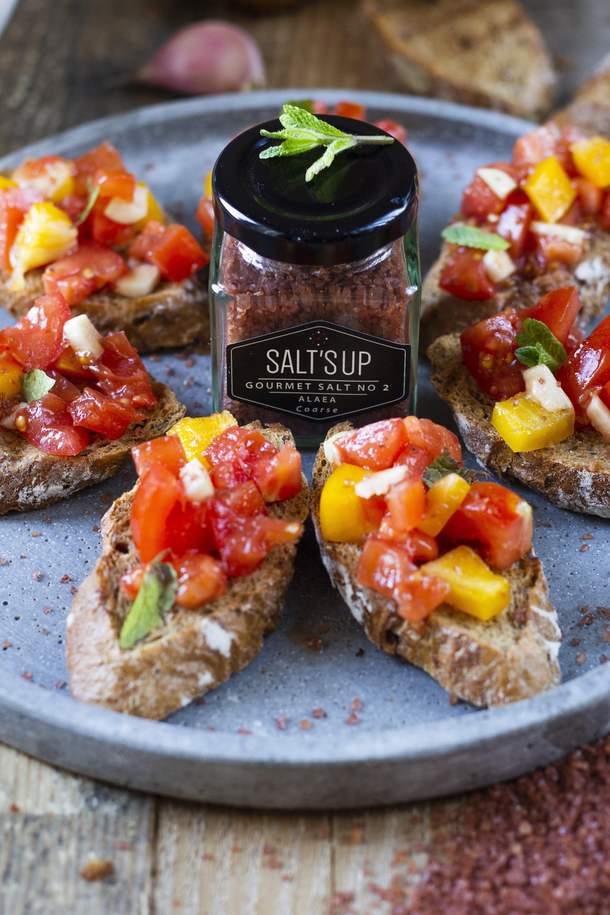 ALAEA coarse salt ecopack featuring traditional Hawaiian sea salt with a reddish hue from volcanic clay, packaged in eco-friendly materials.