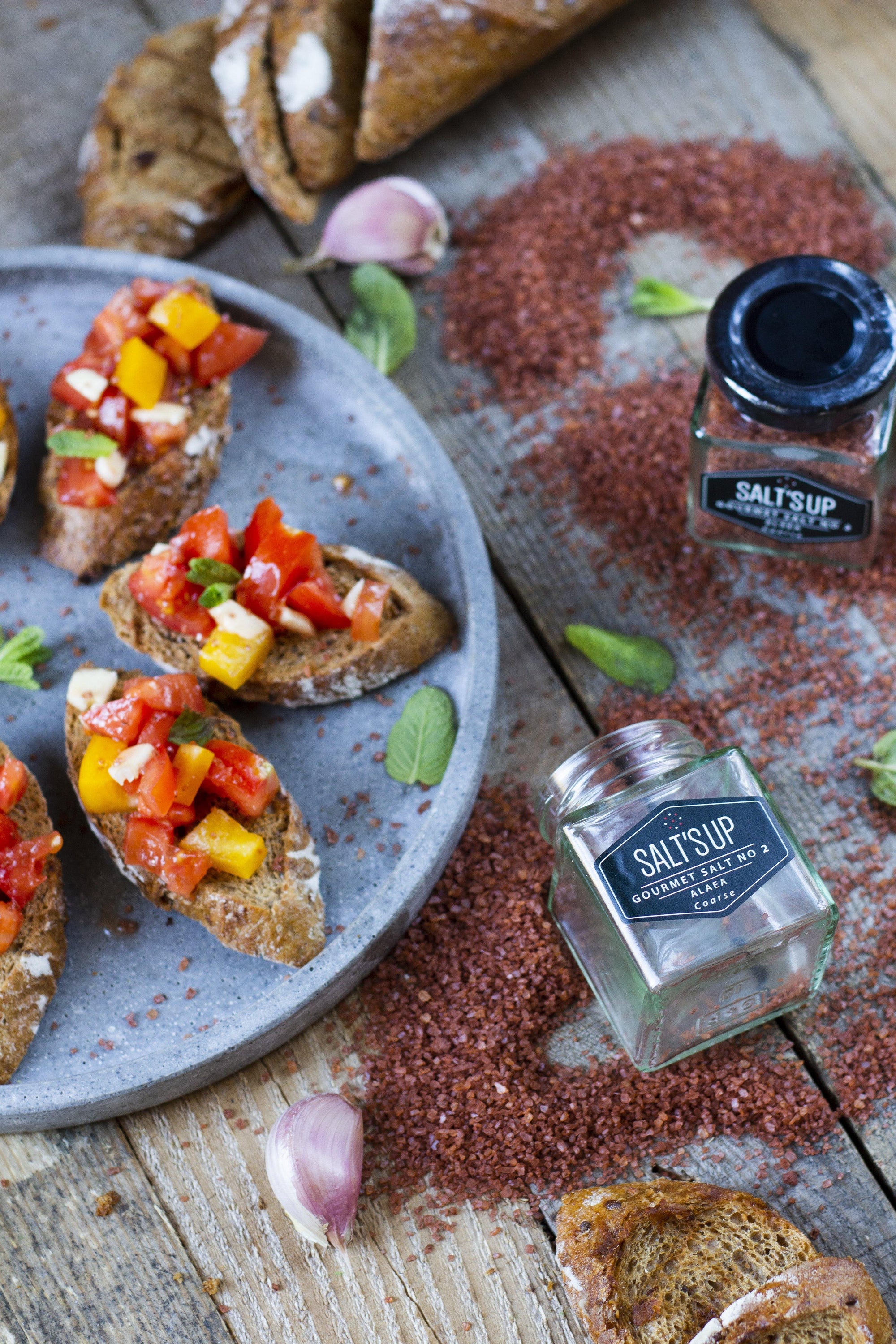 ALAEA coarse salt ecopack featuring traditional Hawaiian sea salt with a reddish hue from volcanic clay, packaged in eco-friendly materials.