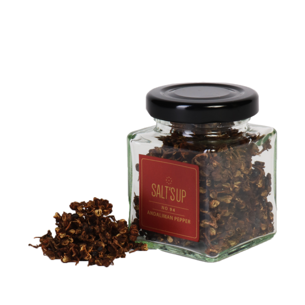 A jar of Andaliman pepper showcasing its vibrant color and unique texture, sourced from the jungles of Indonesia.