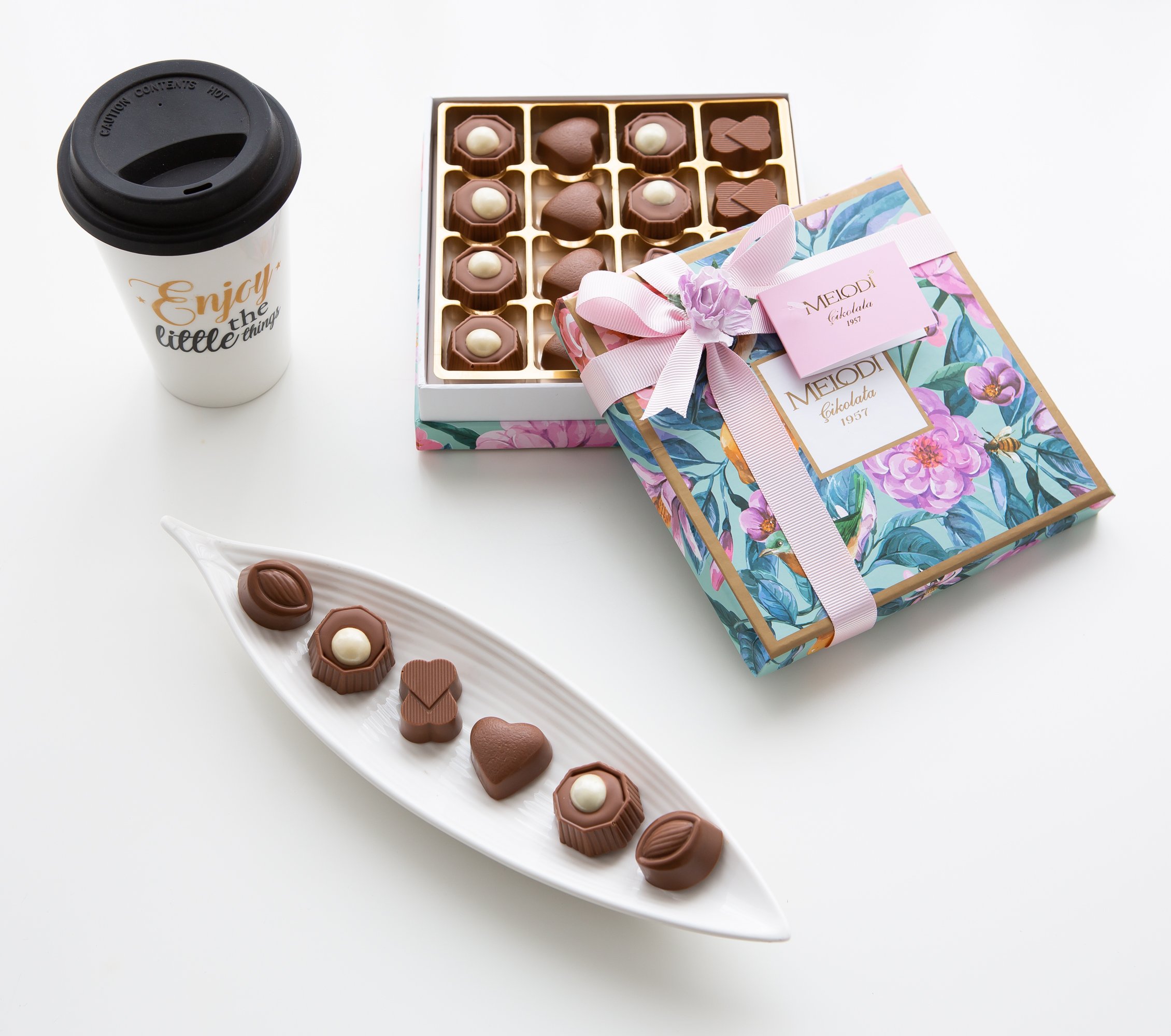 Assorted Chocolate Candy Truffles in a rose gift box with ribbon, featuring dark, milk, and white chocolates with various fillings.