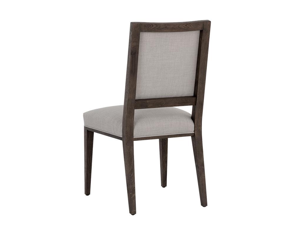 Aurelia Dining Chair featuring a dark brown wood base and light grey fabric upholstery, designed for modern dining spaces.