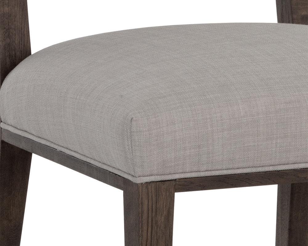 Aurelia Dining Chair featuring a dark brown wood base and light grey fabric upholstery, designed for modern dining spaces.