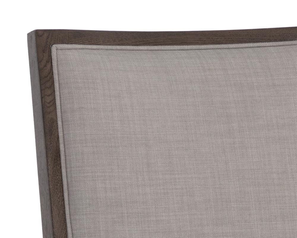 Aurelia Dining Chair featuring a dark brown wood base and light grey fabric upholstery, designed for modern dining spaces.