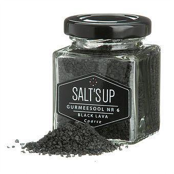 A jar of BLACK LAVA coarse salt showcasing its striking black color and coarse texture, ideal for gourmet cooking.