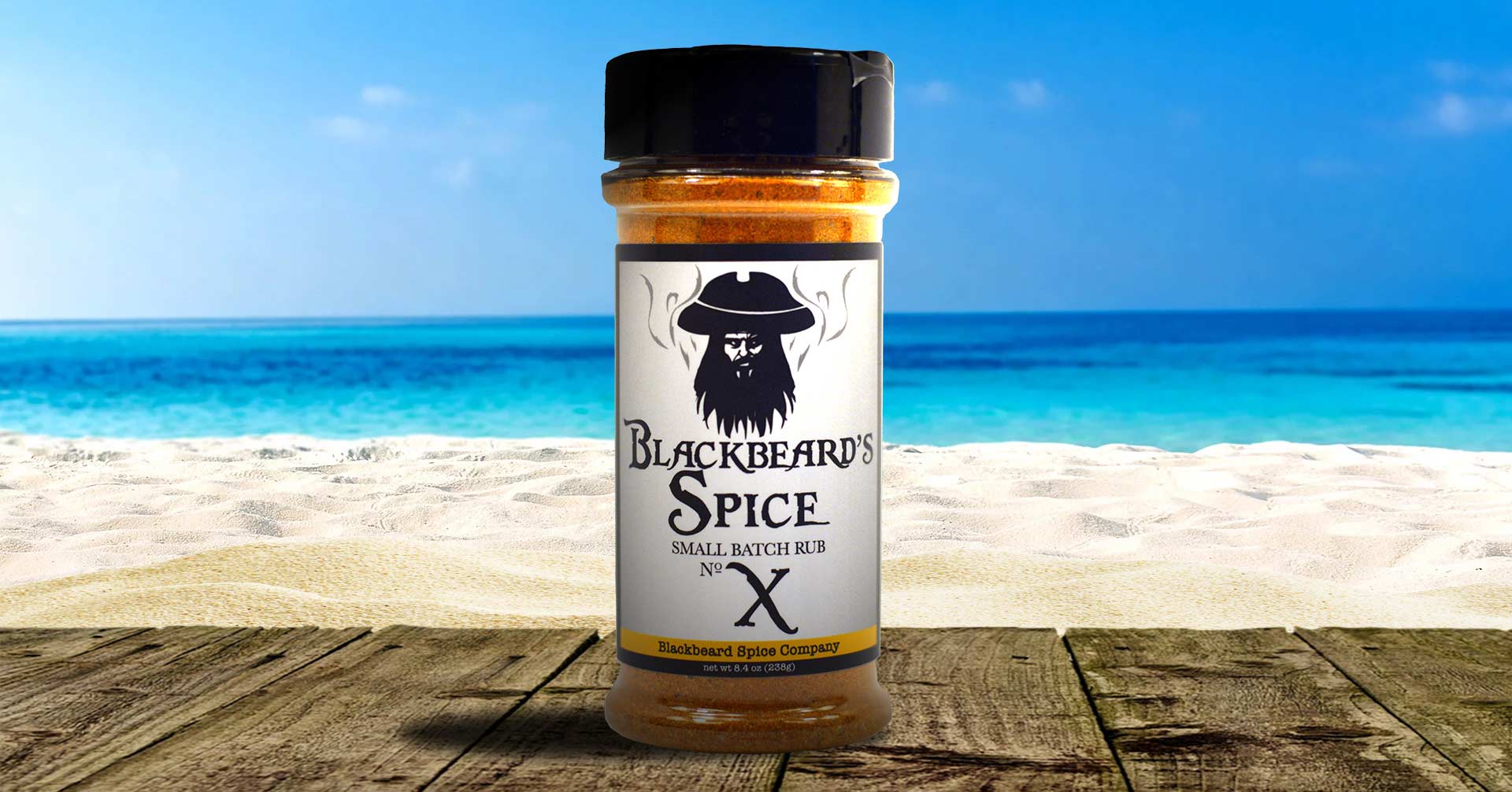 A jar of Blackbeard's Spice Redbeard's Spice Rub with a rustic pirate-themed label, showcasing its rich blend of spices.