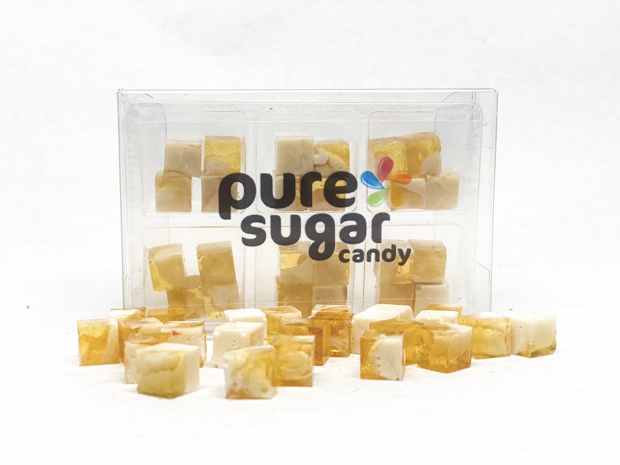 A tray of Candy Cubes featuring Caramel Swirl Ice Cream, showcasing colorful cubes with a rich caramel flavor.